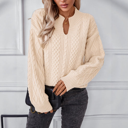 Fashionable women's knitted sweater with a unique cable design and a chic round neck. Amarae