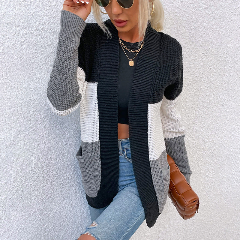 Women's knit jacket with a modern color block design and practical pockets Lune London
