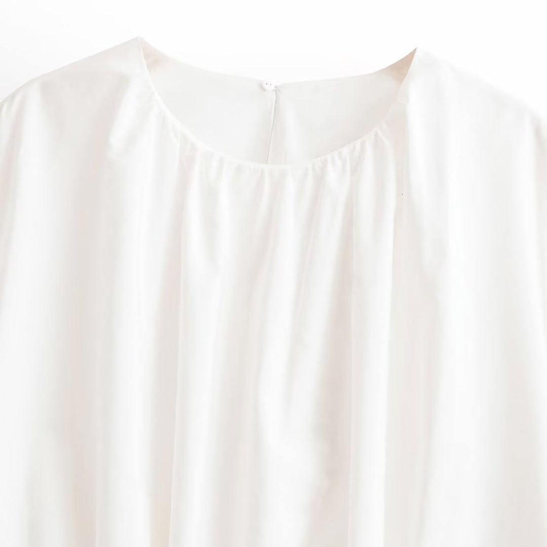 Women's loose cape top made of flowing satin with round neck