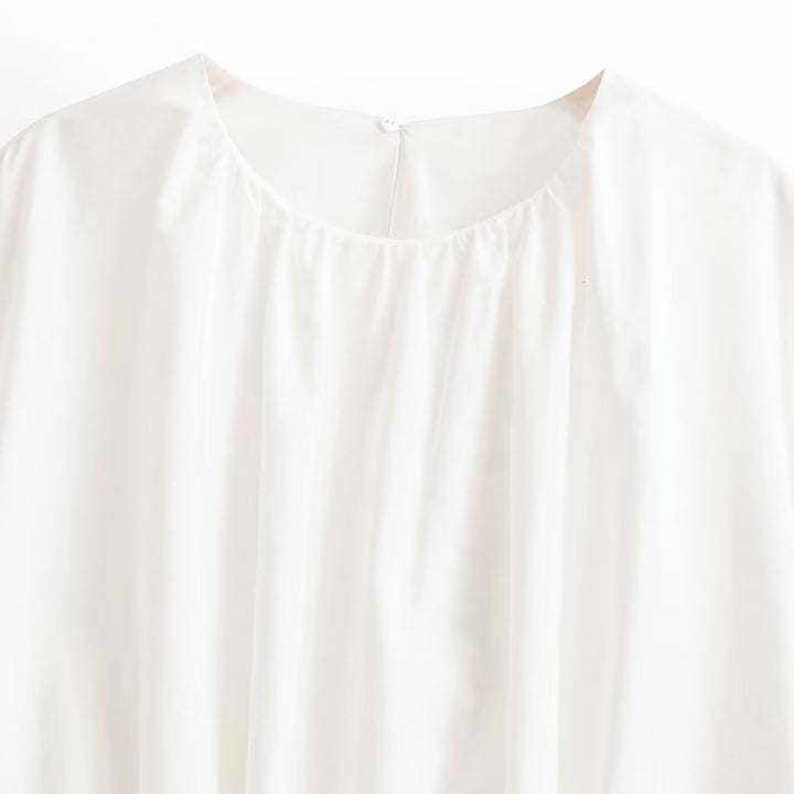 Women's loose cape top made of flowing satin with round neck