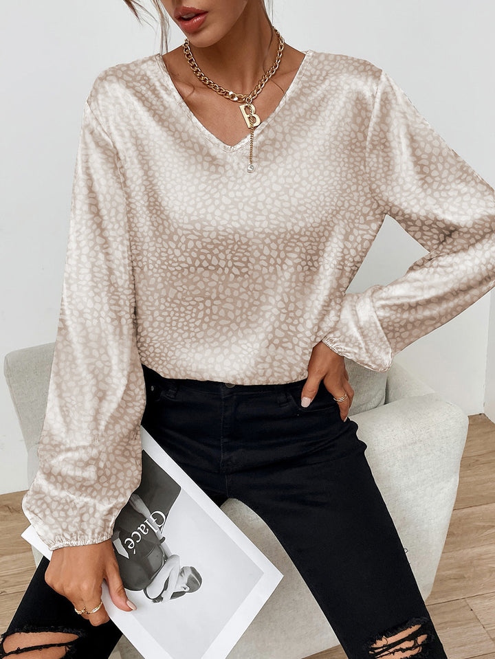 Blouse élégante pour femmes avec col en V et manches volumineuses Chic & Stil