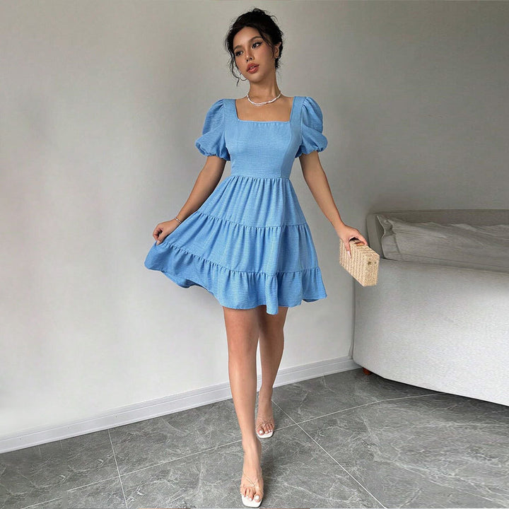 Robe pour femmes avec des manches bouffantes et un ourlet à volants Chic & Stil
