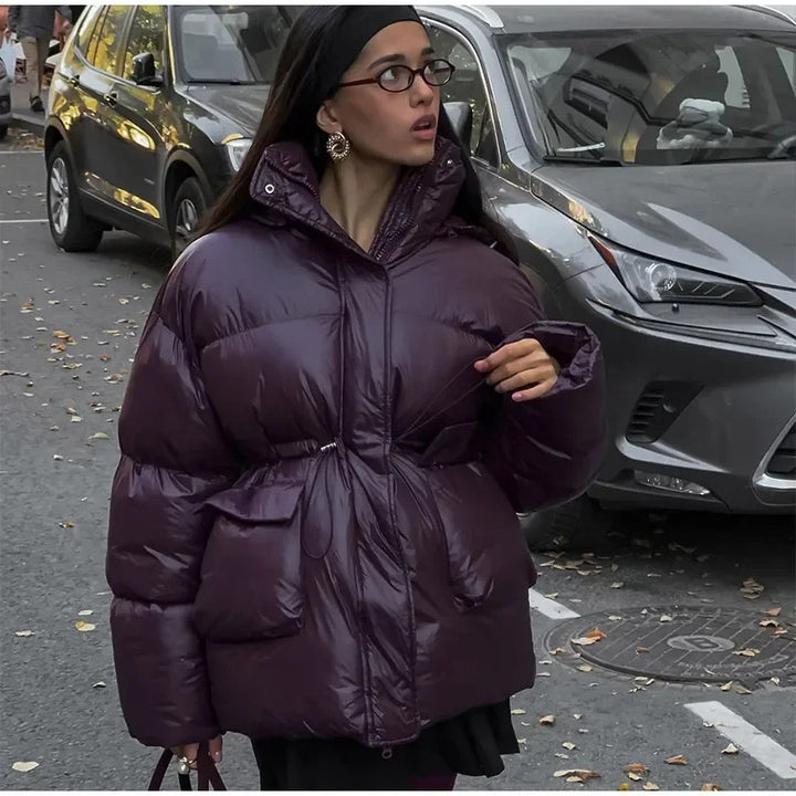 Oversized fashionable down jacket for women with a belted waist and side pockets Lune London