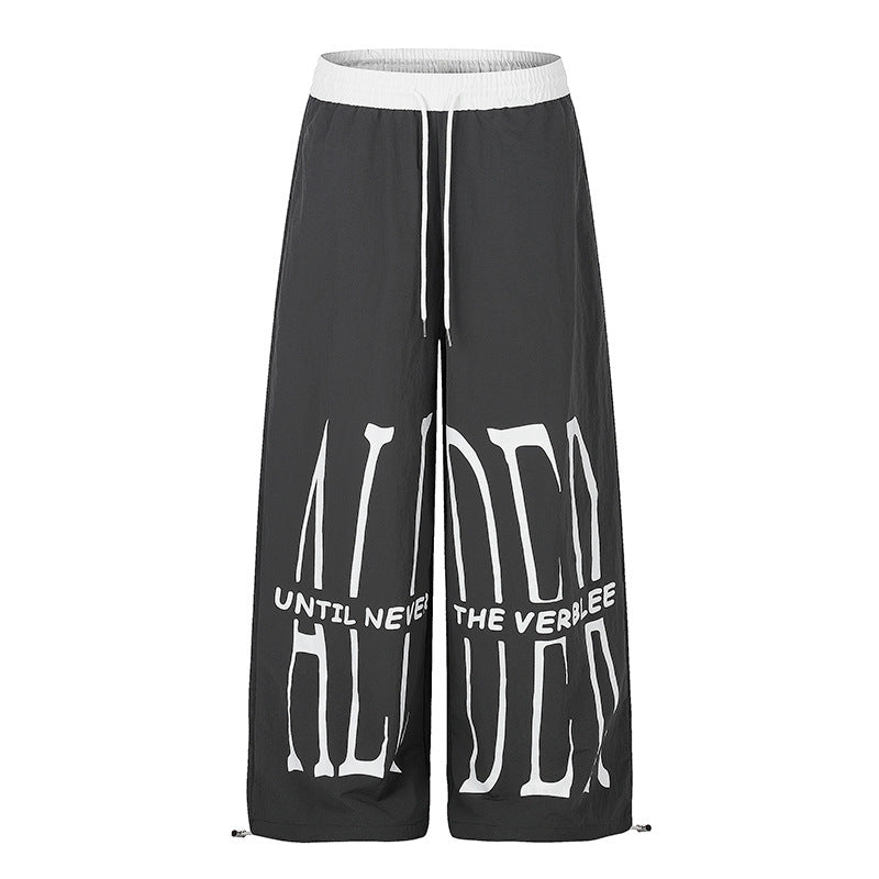 Women's wide loungewear pants with high comfort waistband, drawstring, adjustable hem, and typographic print Amarae