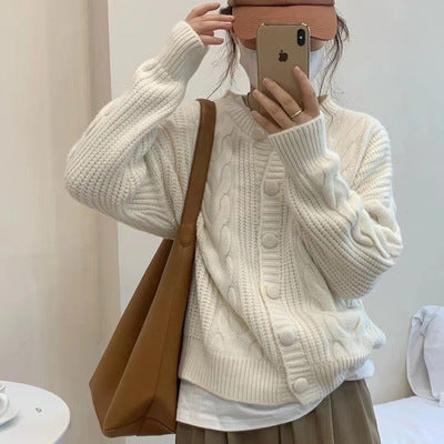 Women's chunky knit sweater with button placket and elegant cable pattern Amarae