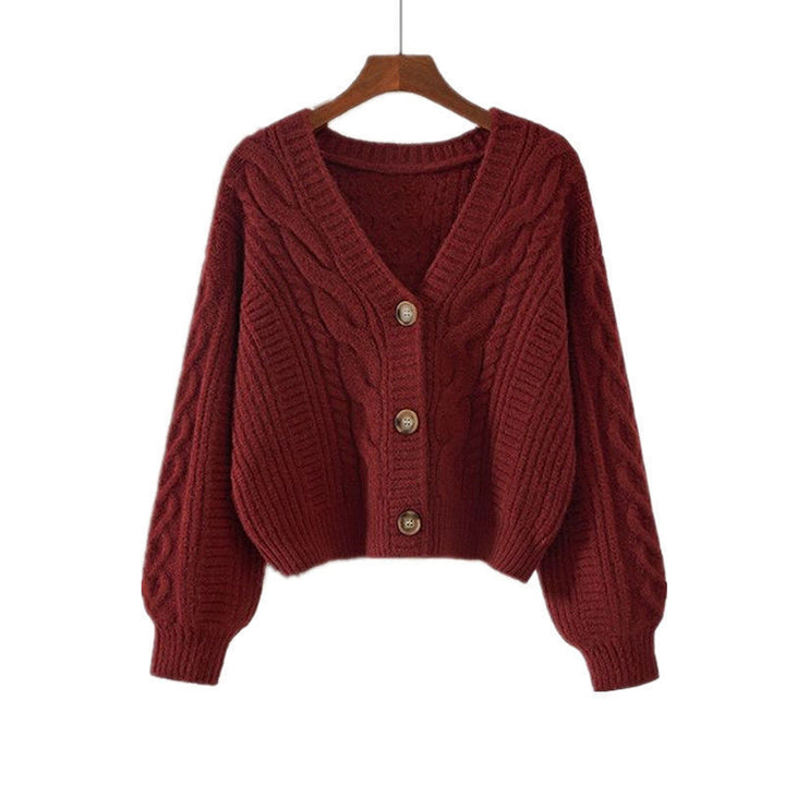 Ladies cozy knitted pullover with cable pattern and button closure Lune London