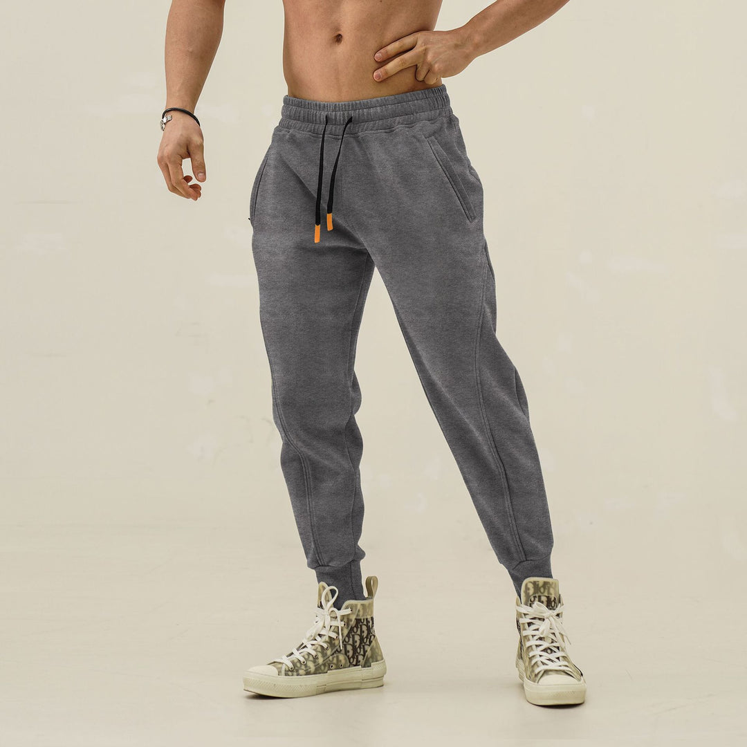 Sporty jogger pants for men with elastic waistband and stylish contrasting stripes Lune London