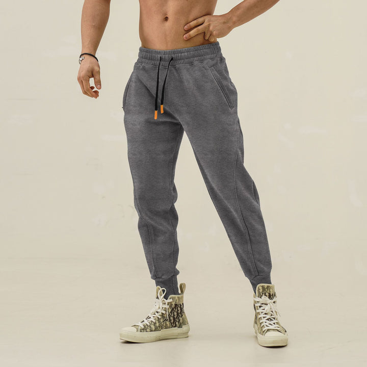 Sporty jogger pants for men with elastic waistband and stylish contrasting stripes Lune London