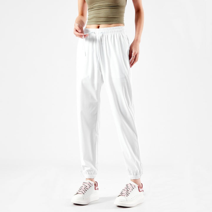 Light sport pants for women with elastic waist and practical pockets Lune London