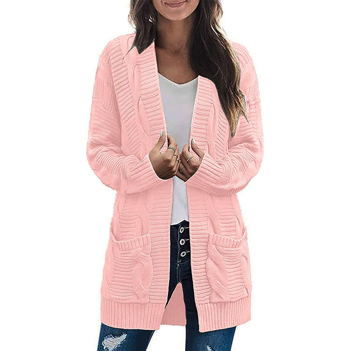Ladies chunky knit cardigan with elegant cable patterns and practical pockets Lune London