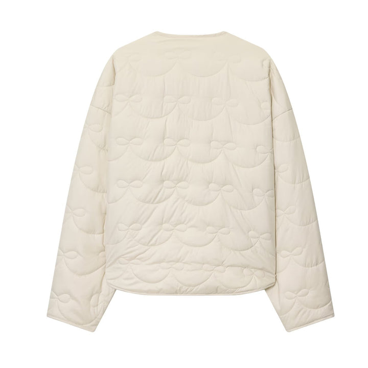 Women's short cut quilted jacket with round neckline and tonal bow quilting Amarae