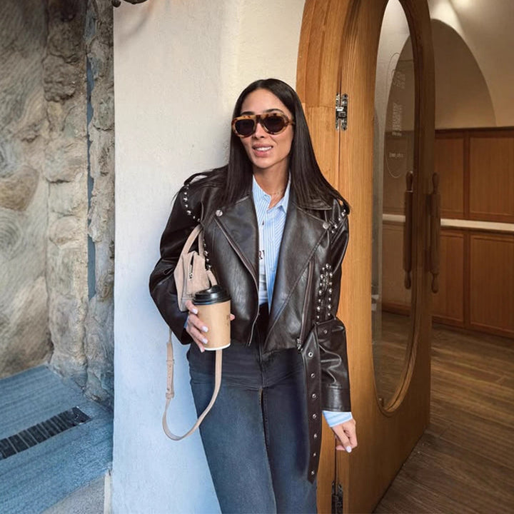 Women's Short Studded Biker Jacket Made of Faux Leather with Waist Belt Amarae