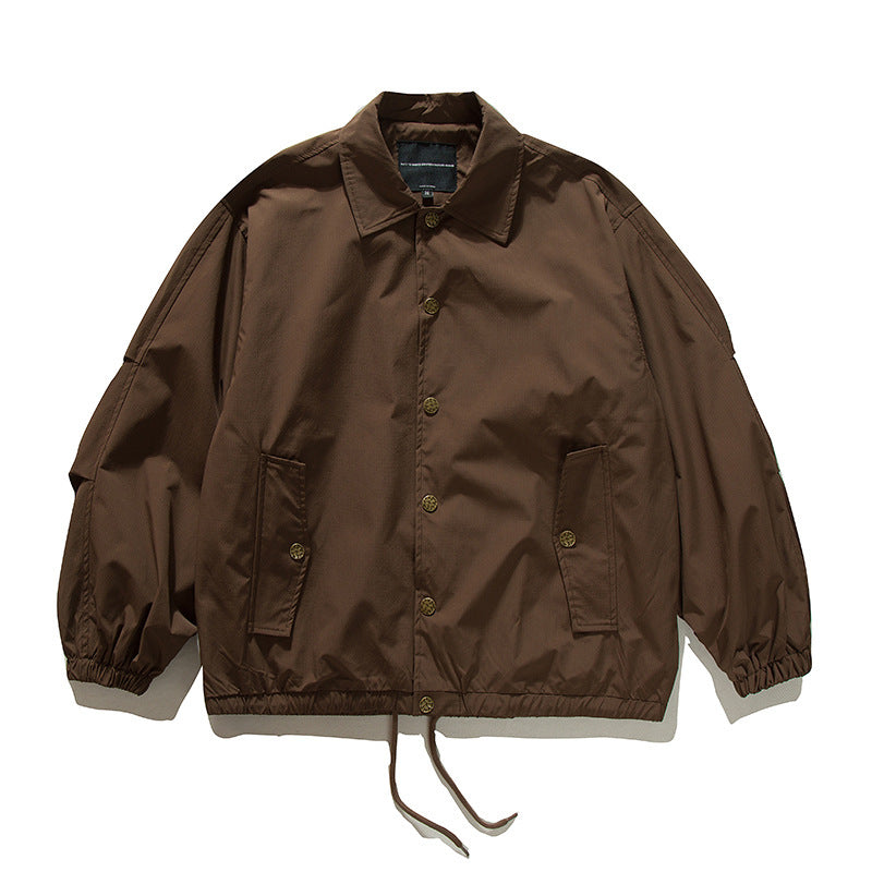 Unisex Boxy transitional bomber jacket with drawstring hem and snap button placket Amarae
