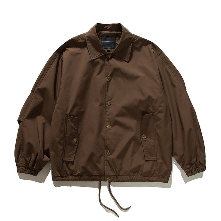 Unisex Boxy transitional bomber jacket with drawstring hem and snap button placket Amarae