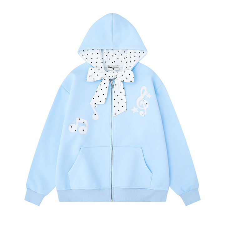 Women's hooded sweat jacket with polka dot hood lining, decorative bow, and music notes motif Amarae