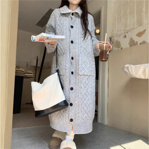 Thick knit button coat for ladies with an elegant cable pattern and practical pockets Amarae