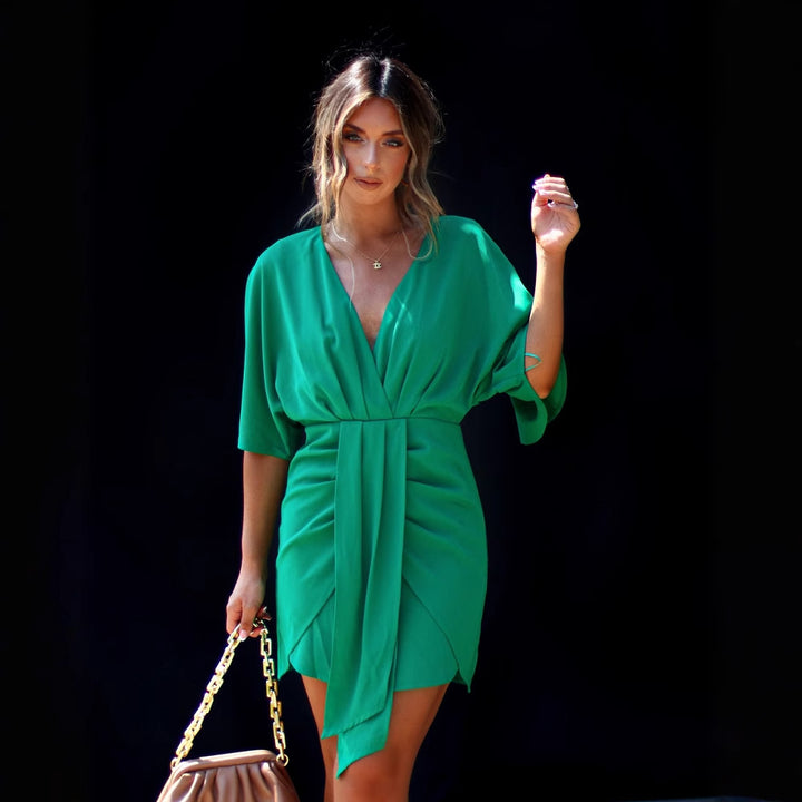 Elegant wrap dress for women with deep V-neckline and flowy fabric Chic & Stil