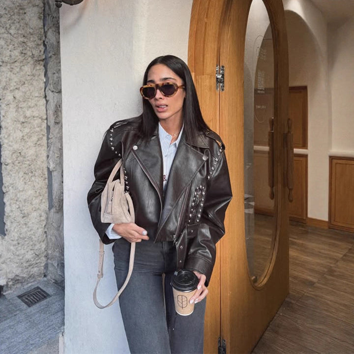 Women's Short Studded Biker Jacket Made of Faux Leather with Waist Belt Amarae