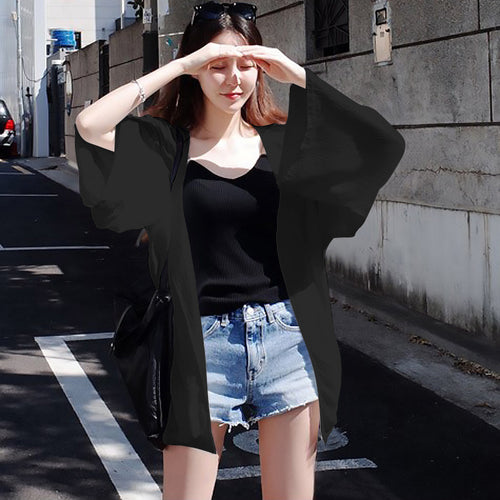Ladies elegant kimono jacket with a loose fit and intricately designed sleeves
