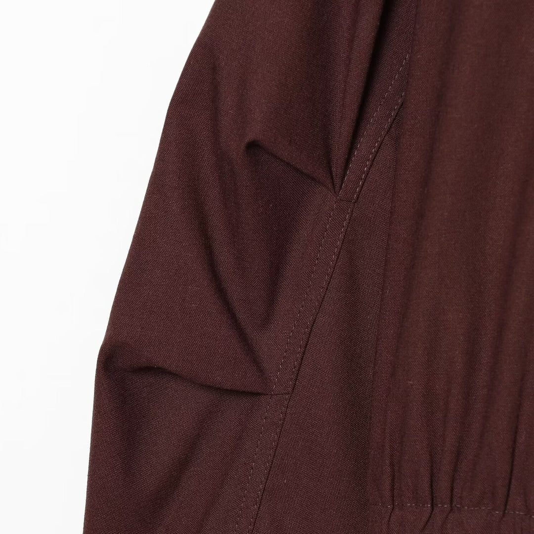 Women's short bomber-style jacket with high funnel collar, concealed zipper, and flap pockets Amarae