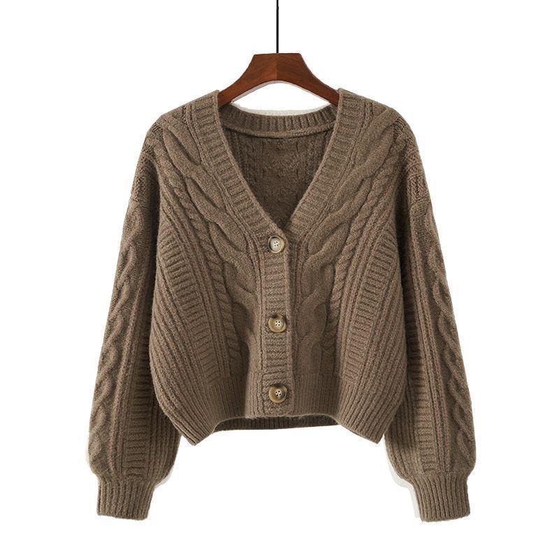 Ladies cozy knitted pullover with cable pattern and button closure Lune London