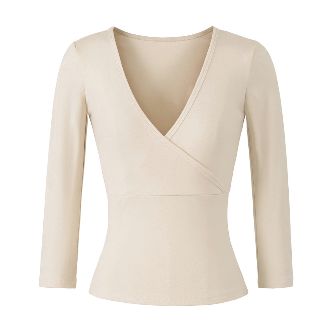 Women's figure-hugging wrap top made of stretch jersey with deep V-neck and tailored silhouette.