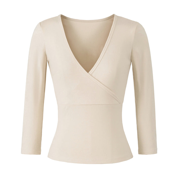 Women's figure-hugging wrap top made of stretch jersey with deep V-neck and tailored silhouette.