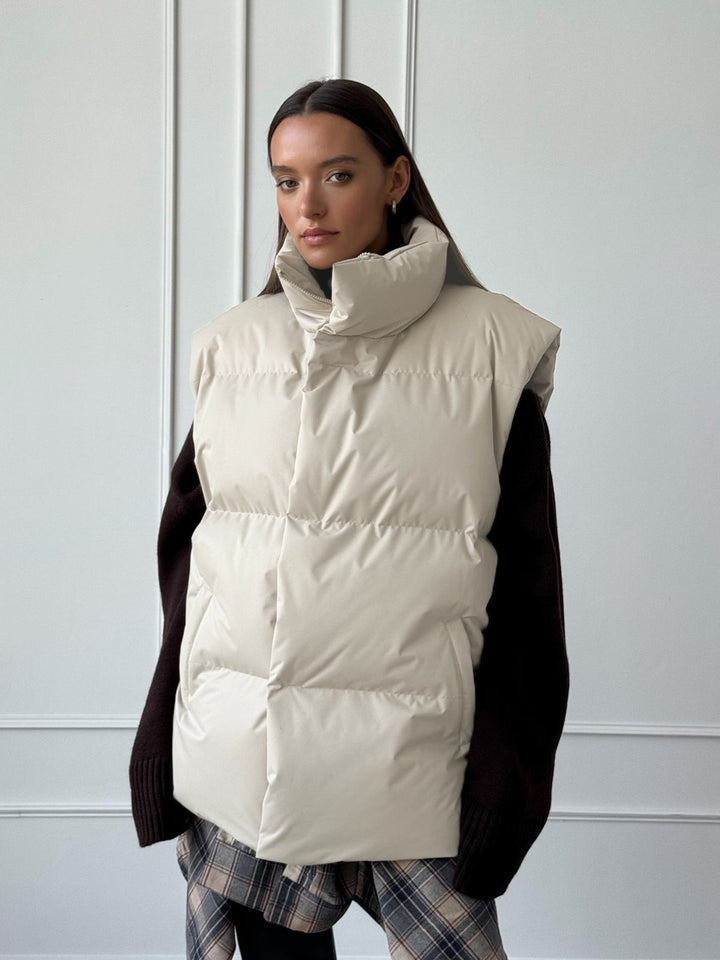 Ladies padded vest with high collar and practical side pockets Lune London