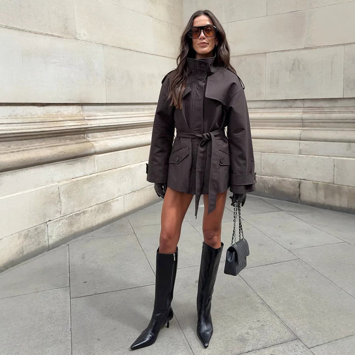 Women's Short Tailored Trench Jacket with Stand-Up Collar, Flap Pockets and Tie Belt Amarae