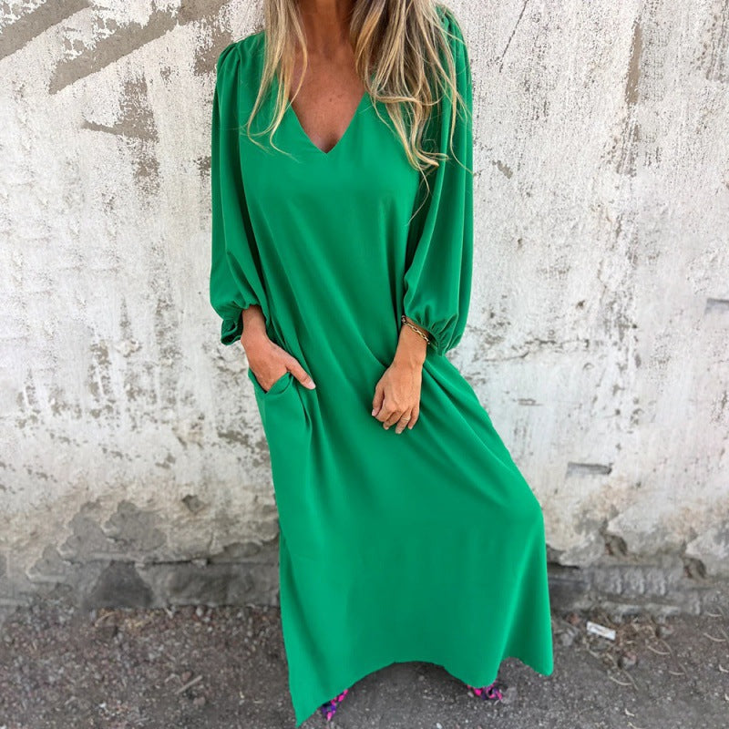 Maxi dress for women with deep V-neckline and practical side pockets Lune London
