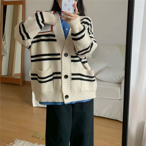 Chunky knit cardigan for women with wide lapels and decorative button details Amarae