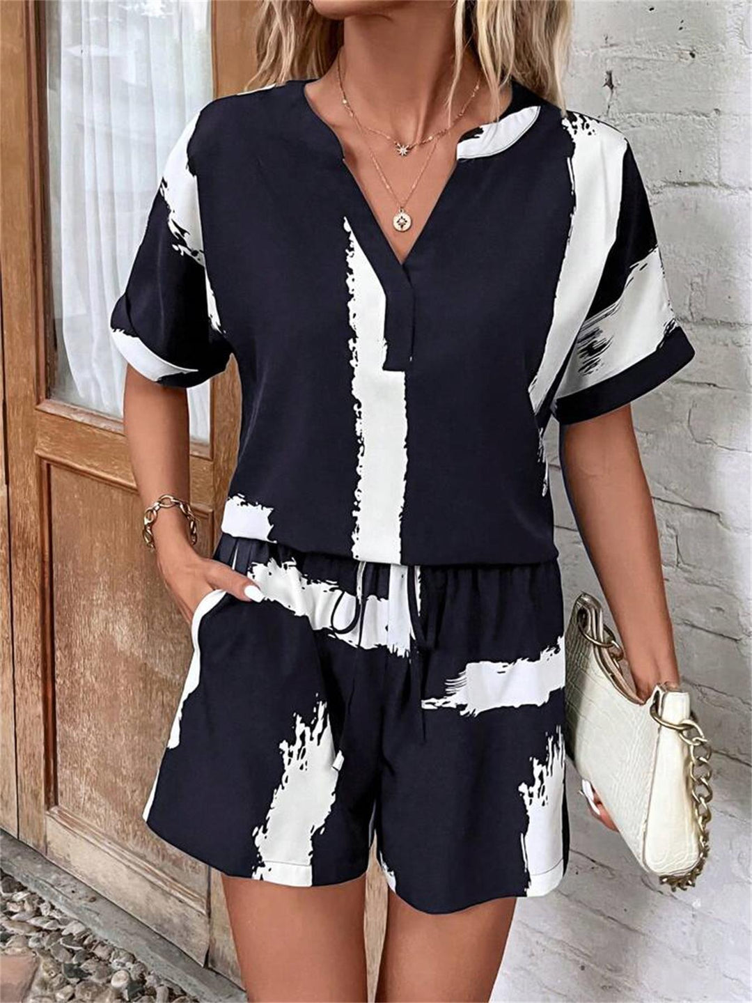 Summer jumpsuit for women with an elegant V-neck and practical pockets Lune London