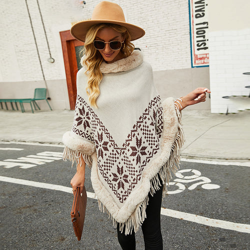 Elegant women's poncho with decorative fringe design and faux fur trim Amarae