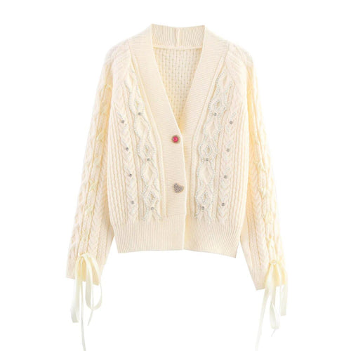 Elegant women's cardigan with decorative buttons and ruffle details Amarae
