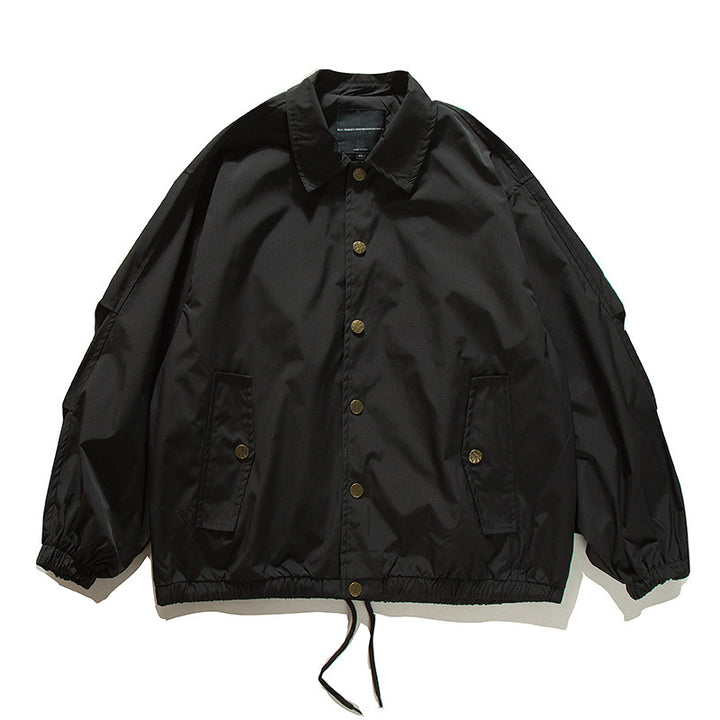 Unisex Boxy transitional bomber jacket with drawstring hem and snap button placket Amarae