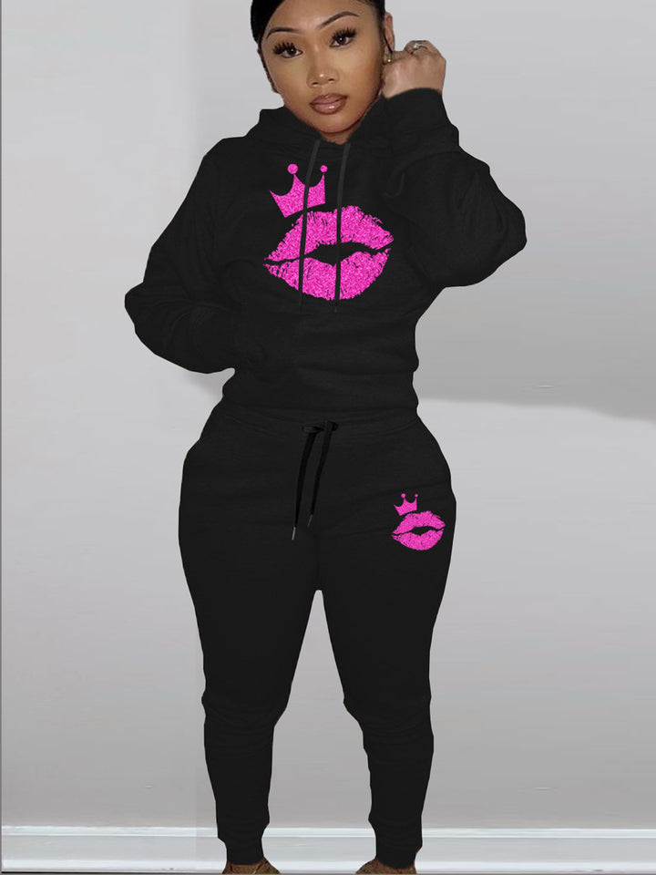 Women's hoodie and jogger set with a catchy lip pattern and a Lune London crown