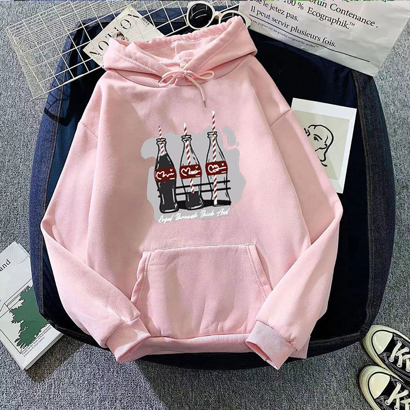 Women's hooded sweatshirt with playful Coca-Cola bottle motif Chic & Stil