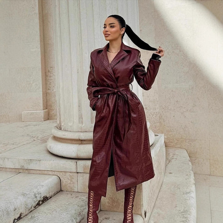 Women's long coat made of faux leather with crocodile embossing and waist belt Amarae