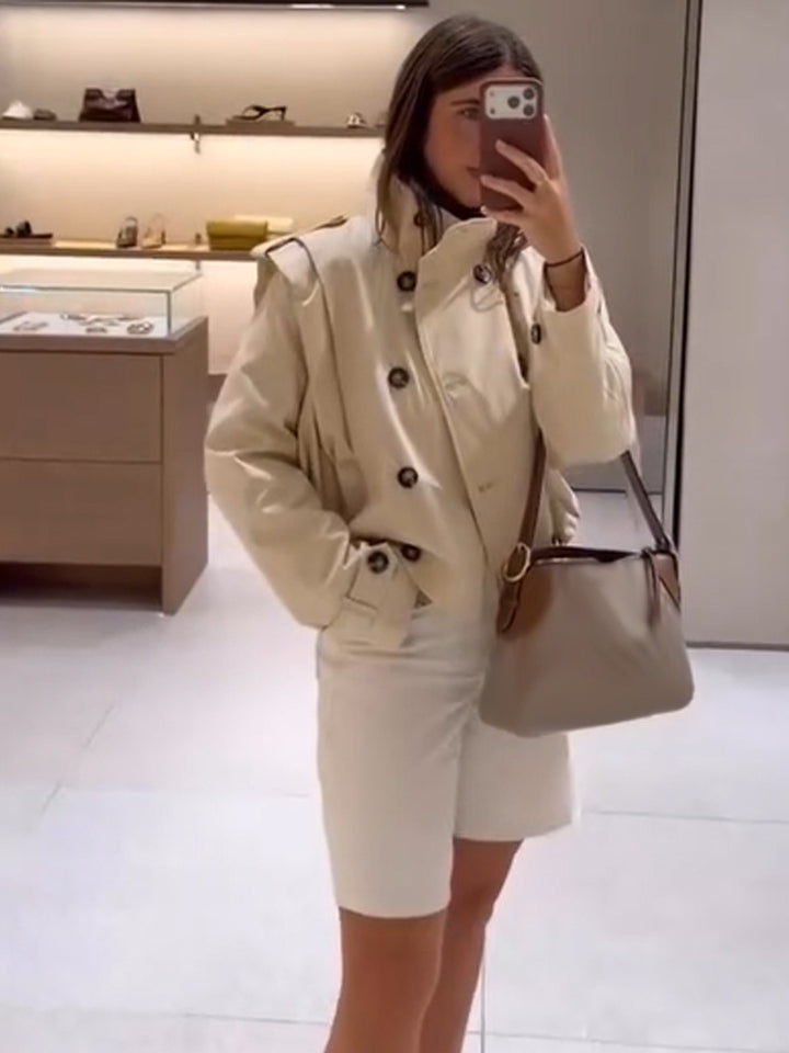 Women's tailored short trench coat with double-breasted style, stand collar and shoulder flaps Amarae