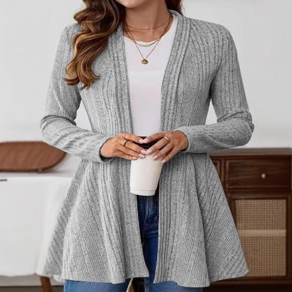Women’s knitted jacket with a playful design and a chic side belt.