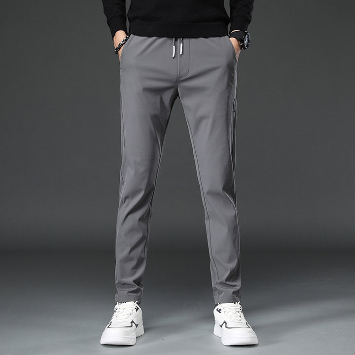 Men's slim fit sports pants with elastic waistband and practical zip pockets Lune London