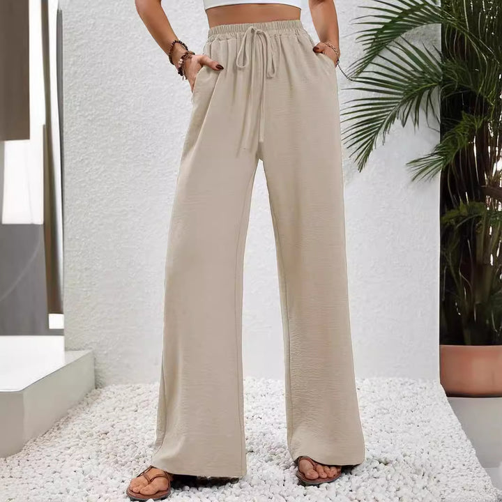 Pantalons larges d'été pour femmes avec taille élastique et poches latérales pratiques Chic & Stil
