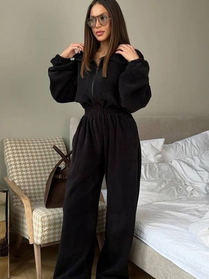 Ladies fleece jumpsuit with large puff sleeves and a high collar Lune London