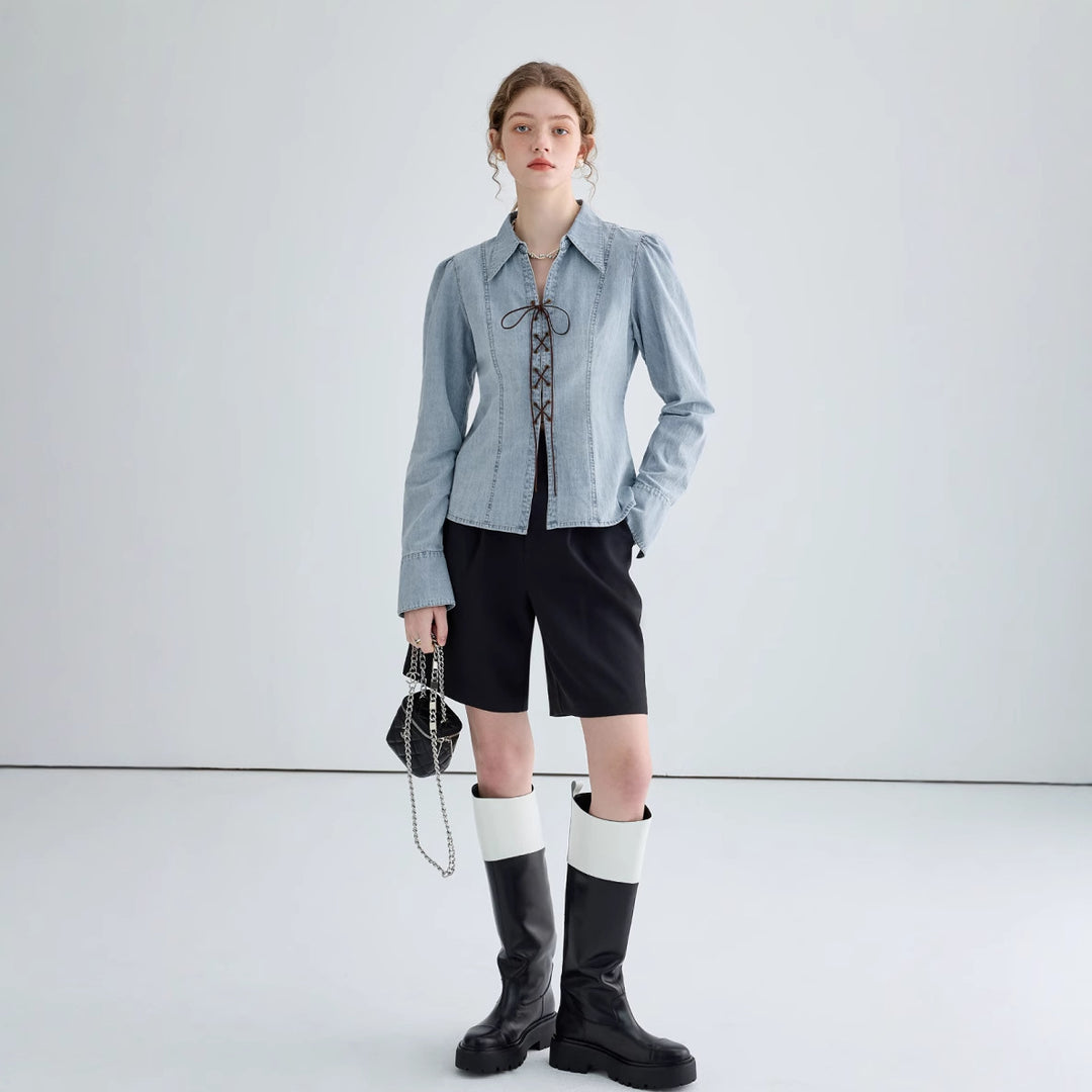 Ladies' jeans blouse with playful lacing details and elegant cut