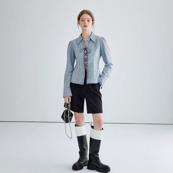 Ladies' jeans blouse with playful lacing details and elegant cut