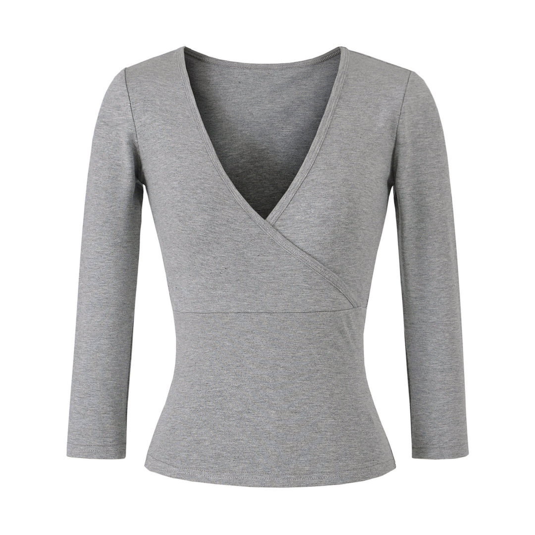 Women's figure-hugging wrap top made of stretch jersey with deep V-neck and tailored silhouette.