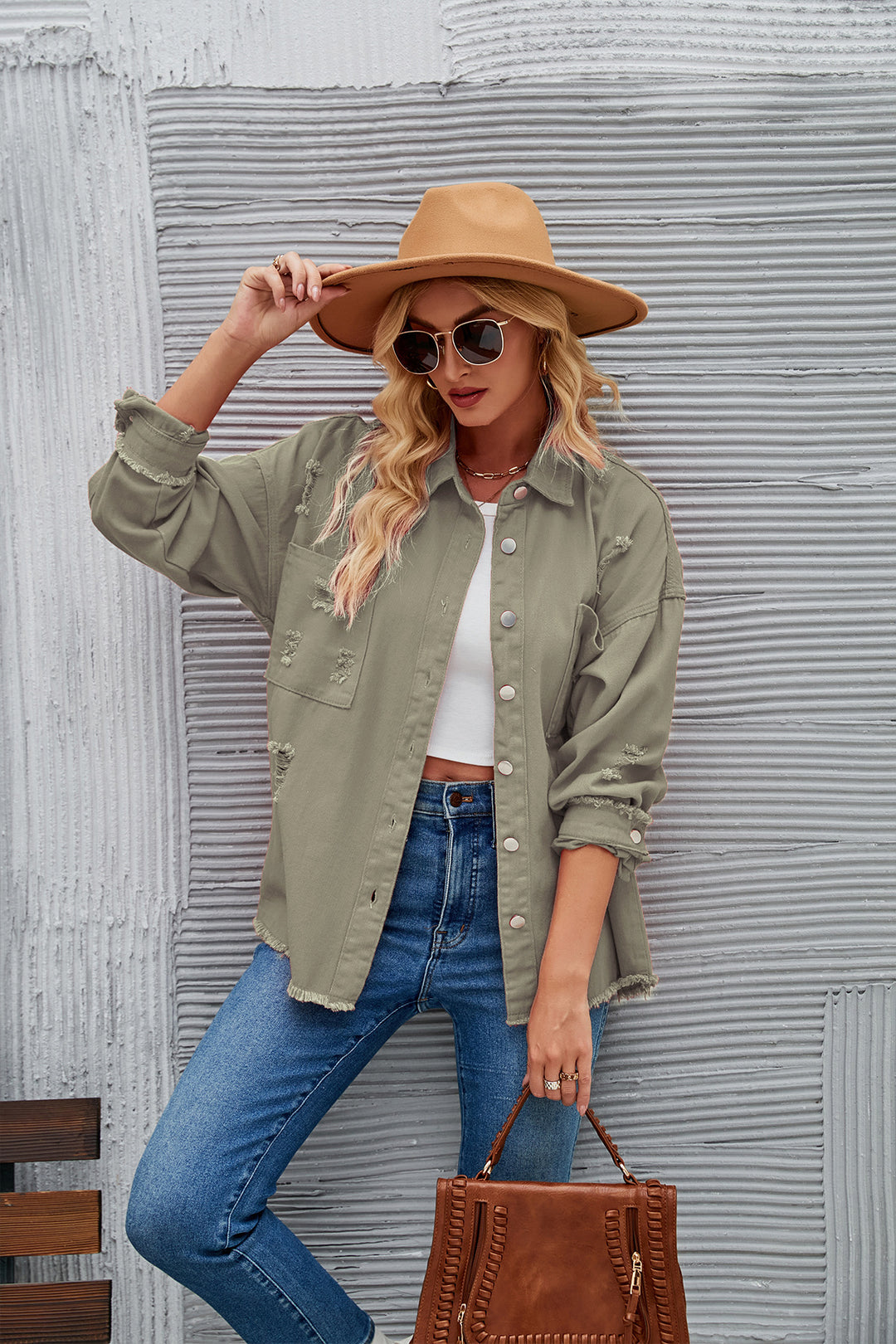 Oversized denim jacket for women with distressing effects