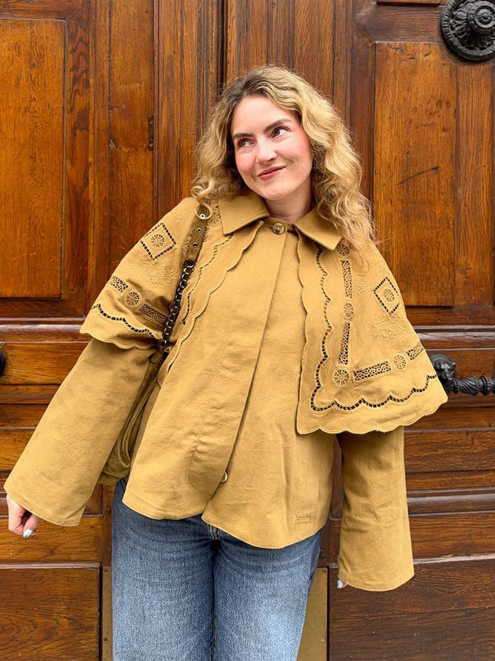 Women's short jacket with embroidered cape, eyelet embroidery and curved hem Amarae