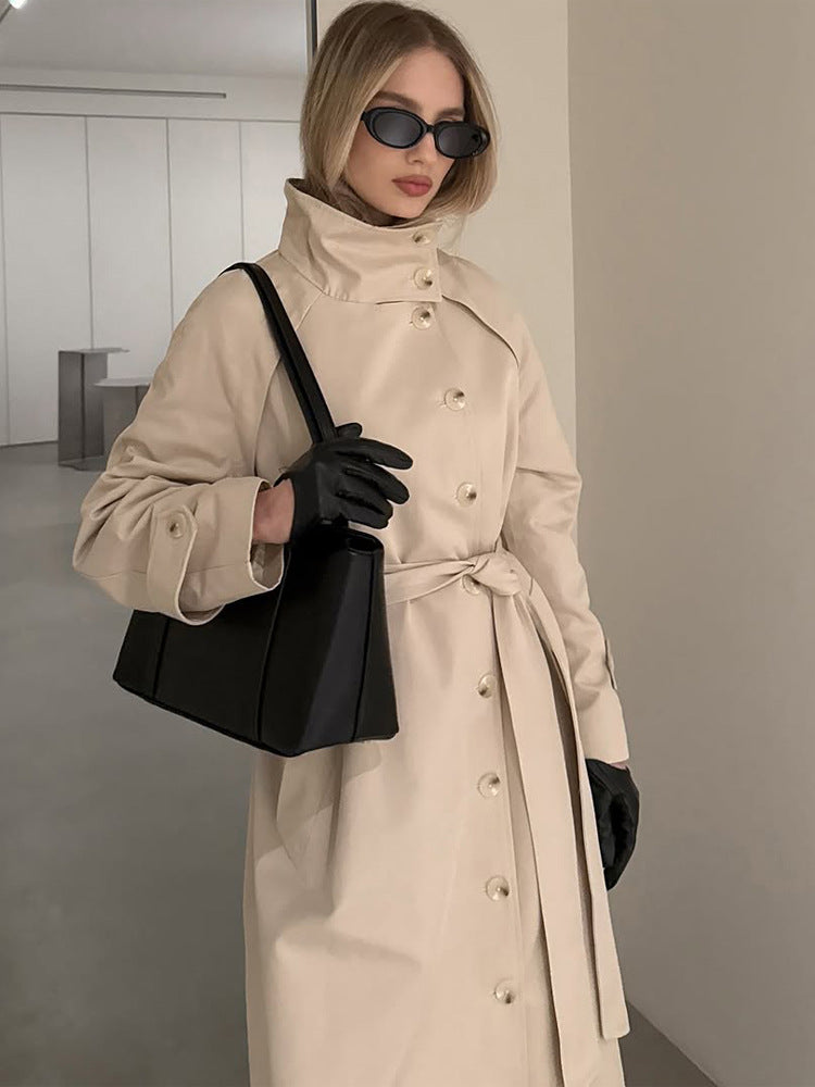 Ladies maxilength trench coat with high stand-up collar, double-breasted button placket and tie belt Amarae