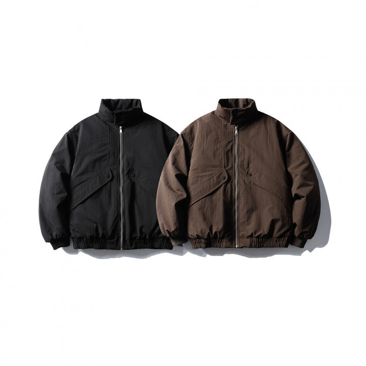 Unisex short boxy isolation jacket with diagonal flap pocket detail and elastic hem Amarae